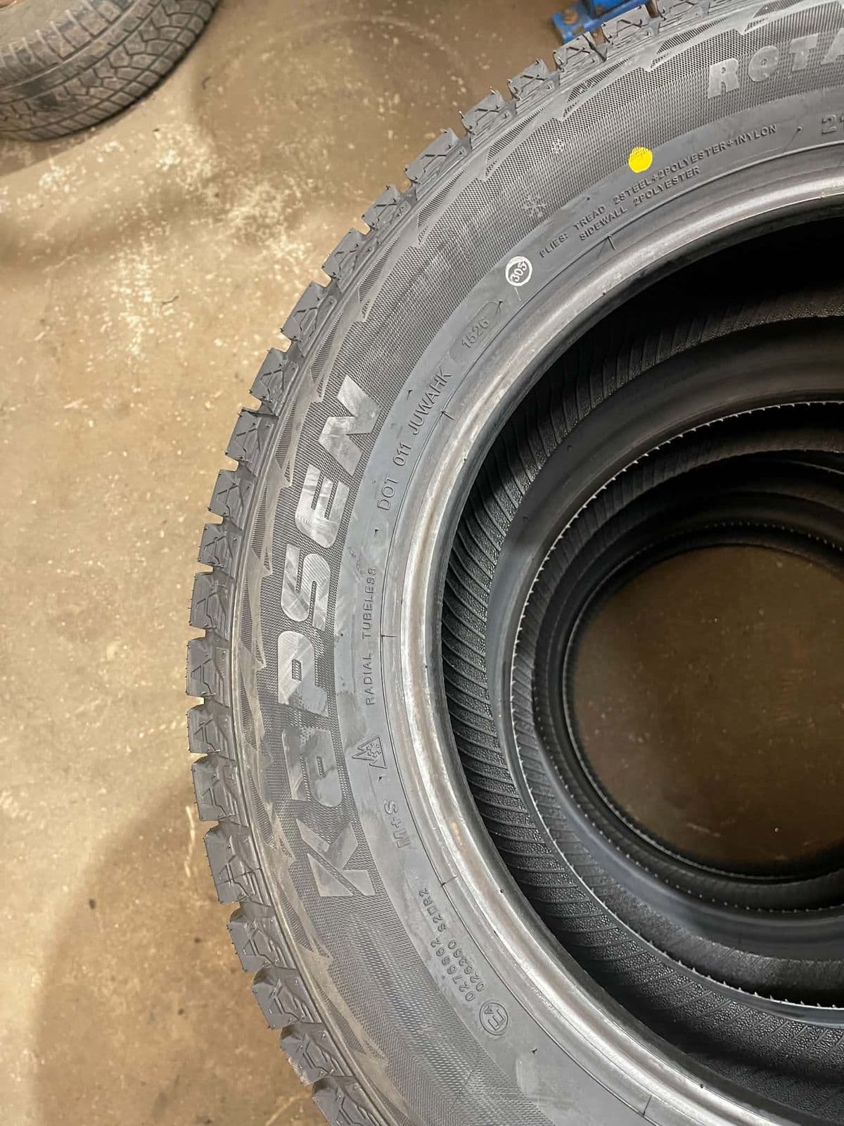 The Kapsen name and the three-peak mountain snowflake moulded into the sidewall of an RW501 winter tire